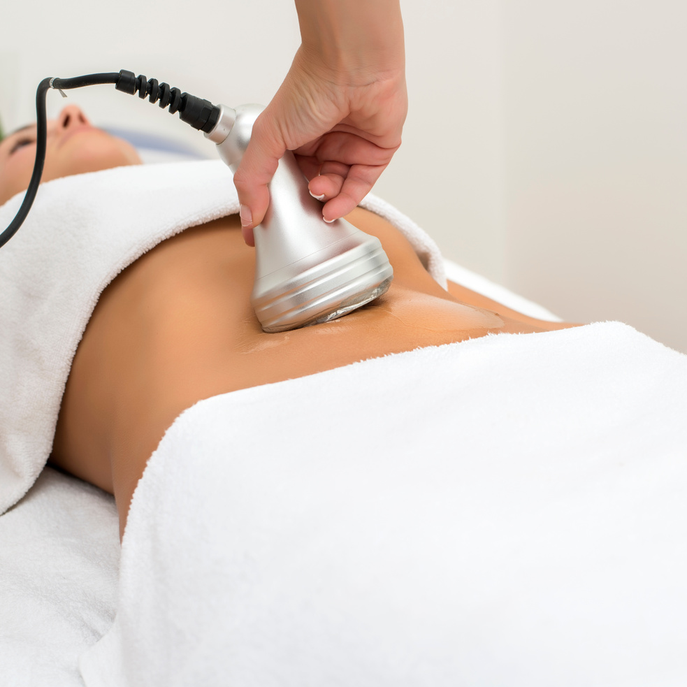 Sculpting Machine Against a Client's Stomach 